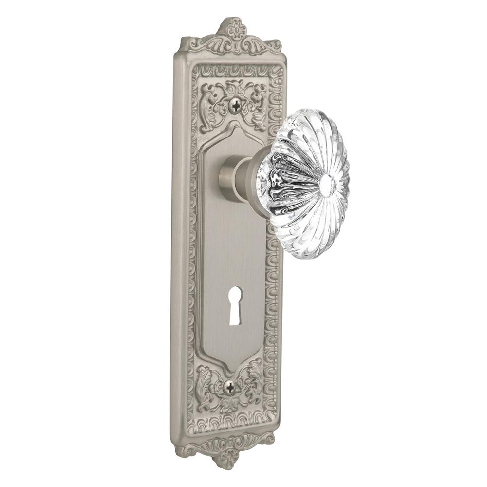 Nostalgic Warehouse EADOFC Single Dummy Egg and Dart Plate with Oval Fluted Crystal Knob with Keyhole in Satin Nickel